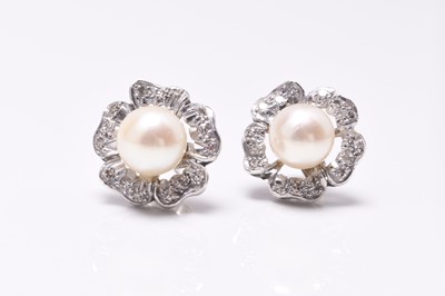 Lot 23 - A pair of cultured pearl and diamond floral cluster earrings