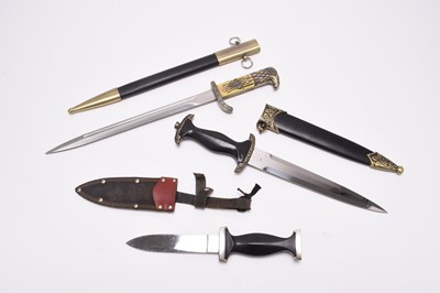 Lot 222 - Two copies of German Third Reich daggers and one Whitby dagger