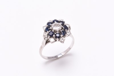 Lot 152 - A sapphire and diamond circular cluster ring