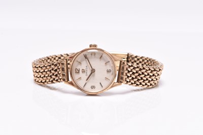 Lot 487 - Omega: A lady's 9ct gold bracelet watch