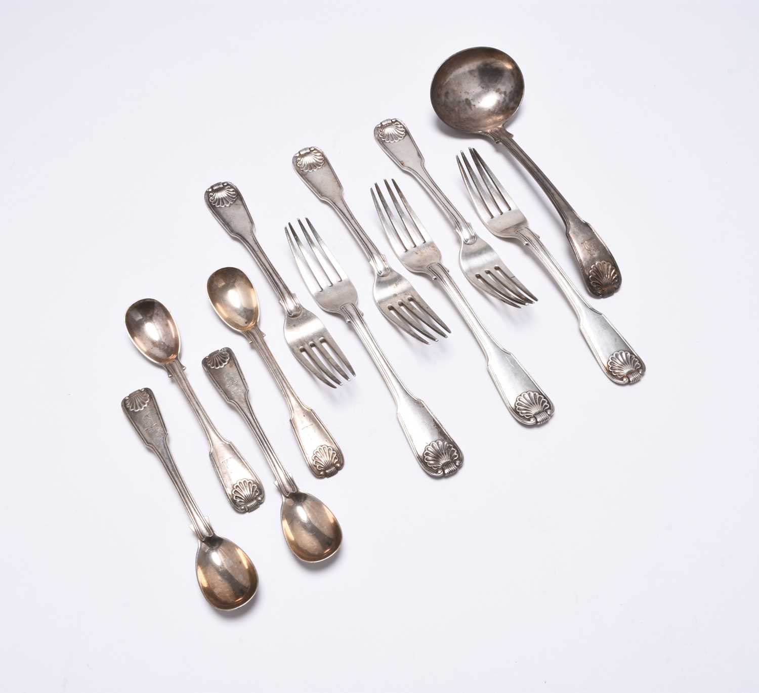 Lot 87 - A collection of George III Irish Fiddle and Shell pattern silver flatware