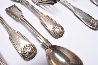 Lot 87 - A collection of George III Irish Fiddle and Shell pattern silver flatware