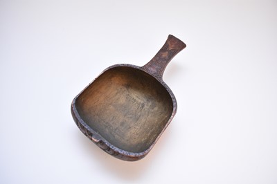 Lot 543 - A Russian carved wooden ladle, carved with detail celebrating New Year