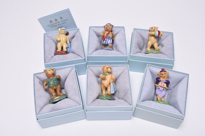 Lot 129 - Twenty Halcyon Days porcelain teddy models, with related book and matchbox holder