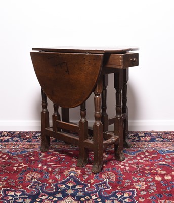 Lot 166 - A 17th century oak drop-leaf gateleg table