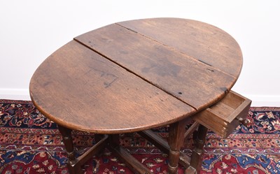 Lot 166 - A 17th century oak drop-leaf gateleg table