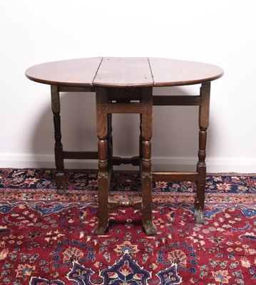 Lot 166 - A 17th century oak drop-leaf gateleg table