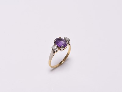 Lot 366 - A three stone amethyst and diamond ring