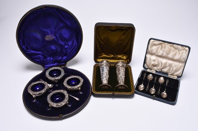 Lot 123 - A cased set of four Edwardian silver salts and a cased pair of Victorian silver vases