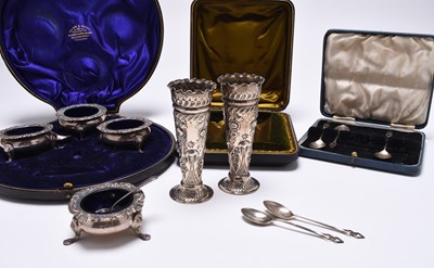 Lot 123 - A cased set of four Edwardian silver salts and a cased pair of Victorian silver vases