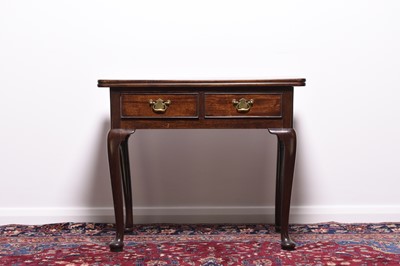 Lot 239 - A 19th century mahogany fold-over tea table