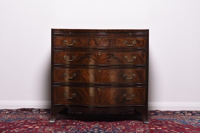 Lot 262 - A reproduction mahogany serpentine fronted dressing chest