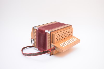 Lot 566 - A contemporary diatonic button accordion