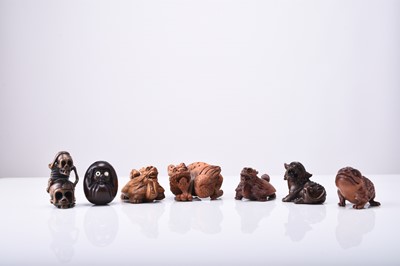 Lot 239 - A group of seven Japanese wood netsuke of mythical creatures, 20th century