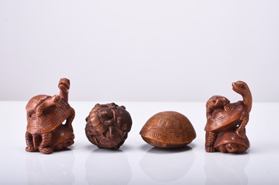 Lot 251 - A group of four Japanese wood netsuke of turtles, 20th century