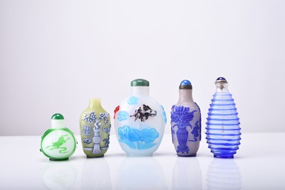 Lot 146 - A group of five Chinese overlay glass snuff bottles, 19th/20th century