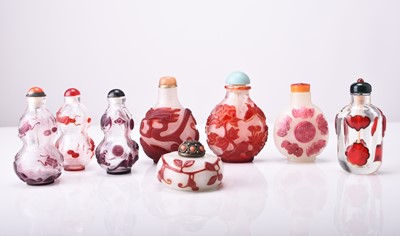 Lot 154 - A group of eight Chinese overlay glass snuff bottles, 19th/20th century