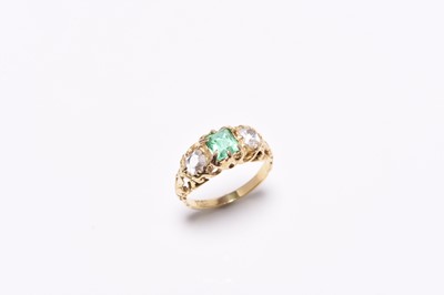 Lot 219 - A late 19th century three stone emerald and diamond ring