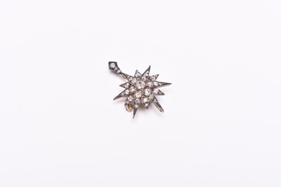 Lot 258 - A late 19th century diamond set starburst brooch/pendant