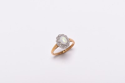 Lot 199 - A Victorian style opal and diamond oval cluster ring