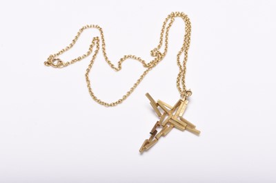Lot 317 - An 18ct gold John Donald abstract crucifix pendant on chain