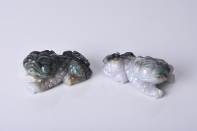 Lot 161 - A pair of Chinese jadeite figures of lion dogs, 20th century
