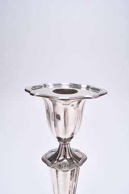 Lot 3 - A pair of silver mounted candlesticks