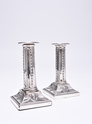 Lot 53 - A pair of Edwardian short silver candlesticks