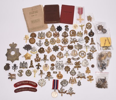 Lot 201 - A group of British cap badges and other insignia