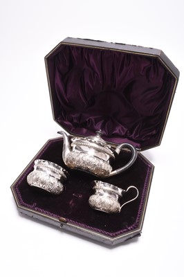 Lot 50 - A Victorian cased three piece silver tea service