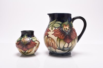 Lot 185 - A Moorcroft jug and vase in the 'Anna Lily' pattern