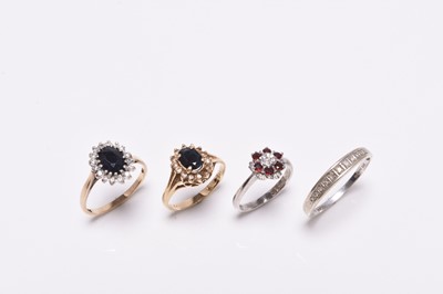 Lot 201 - Four stone set rings