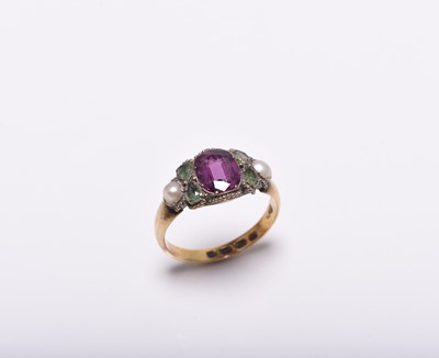 Lot 407 - An 18ct gold almandine garnet, emerald and split pearl ring