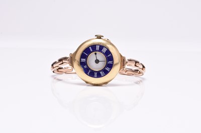 Lot 469 - A lady's 18ct gold and enamel watch on 9ct bracelet