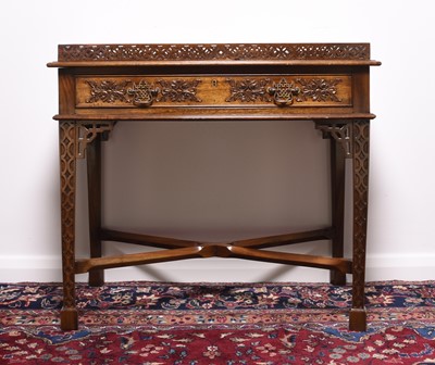 Lot 219 - A reproduction mahogany silver table in the Chippendale style