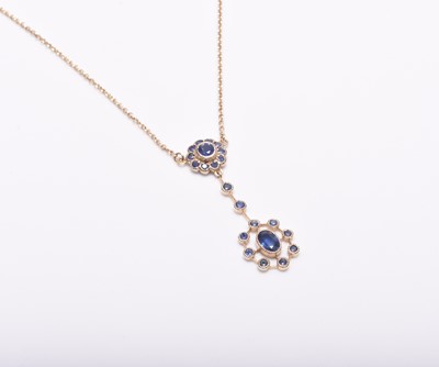 Lot 265 - An early 20th century style 9ct gold sapphire set pendant on chain