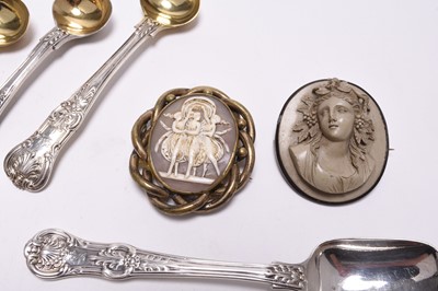 Lot 2 - A collection of silver flatware, a silver vesta case and two brooches