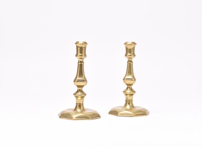 Lot 68 - A pair of Queen Anne brass candlesticks