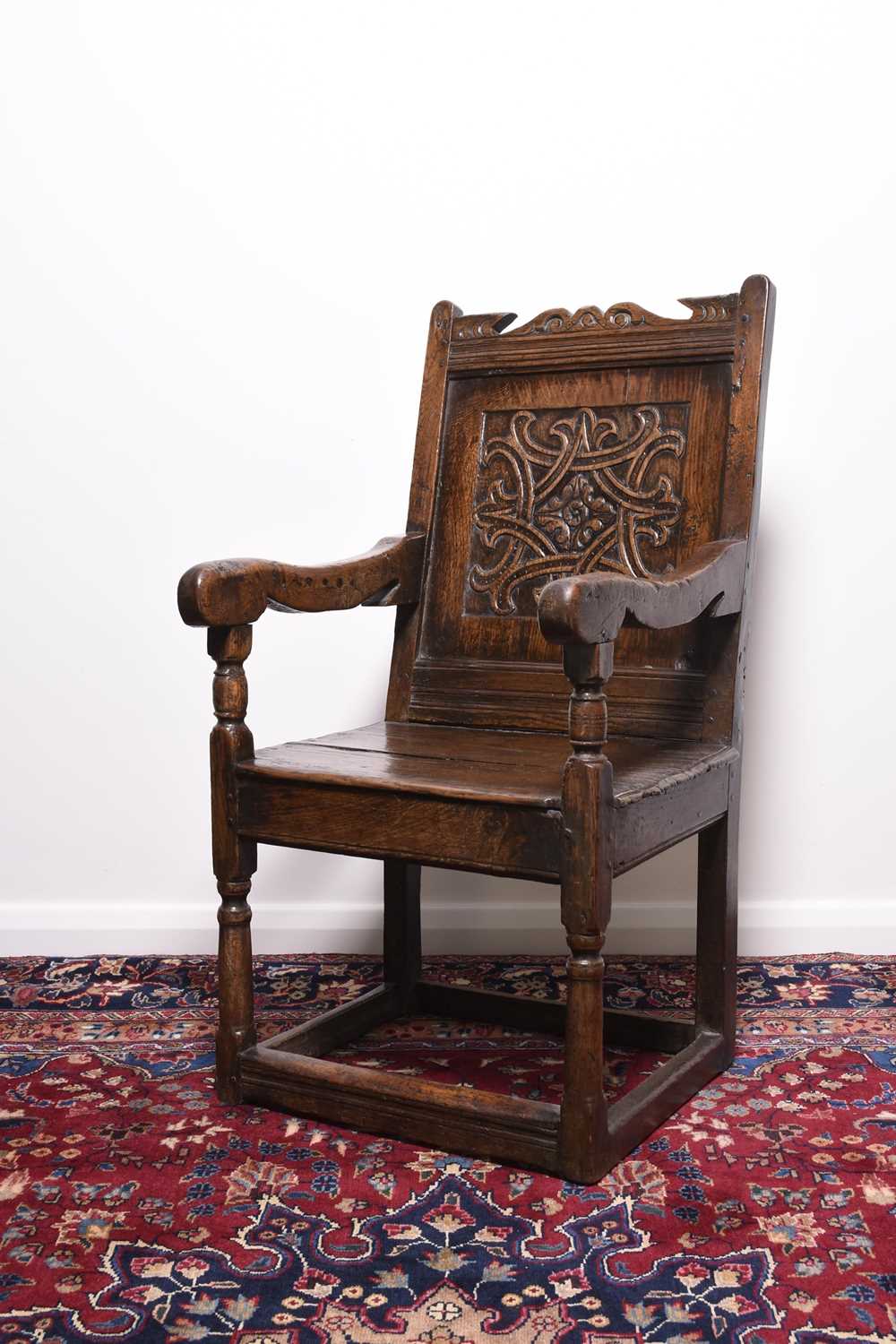 Lot 168 - A mid 17th century oak 'wainscot' armchair, Lake District