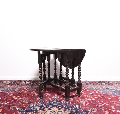 Lot 169 - A late 17th century oak gateleg drop-leaf table