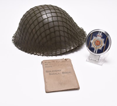 Lot 184 - British Army MKIV helmet, WW1 soldier's small book and RASC car badge