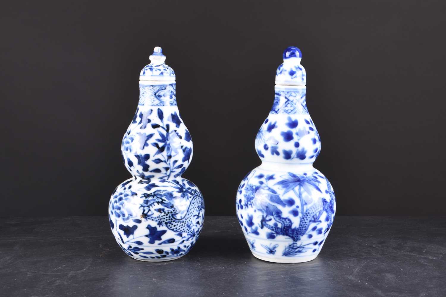 Lot 33 - A near pair of Chinese porcelain vases and covers, 19th century