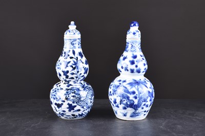 Lot 33 - A near pair of Chinese porcelain vases and covers, 19th century