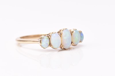 Lot 217 - A late 19th century five stone graduated opal ring