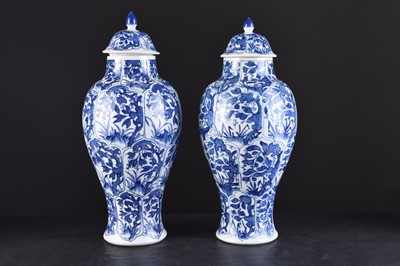 Lot 133 - A pair of Chinese transitional blue and white vases and covers, Kangxi