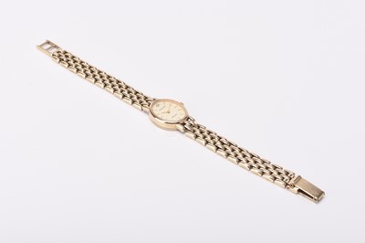 Lot 312 - Accurist: A lady's 9ct gold bracelet watch