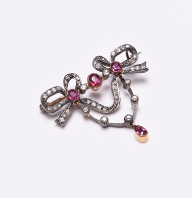 Lot 69 - A ruby and diamond bow brooch  within fitted Wartski box