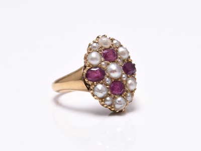 Lot 80 - A late 19th century untested split pearl and ruby set ring