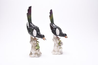 Lot 222 - Two similar German porcelain models of magpies on tree stumps, late 19th century