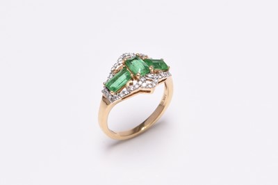 Lot 53 - An 18ct gold emerald and diamond ring